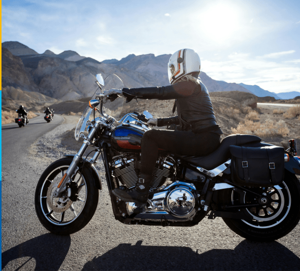 Woman riding her motorcycle covered by motorcycle insurance